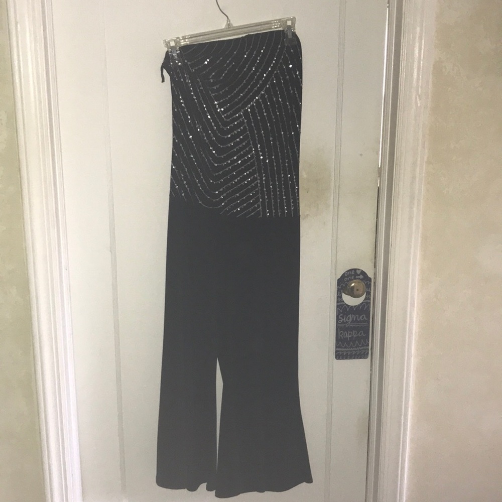 Strapless jumpsuit with sheer jacket